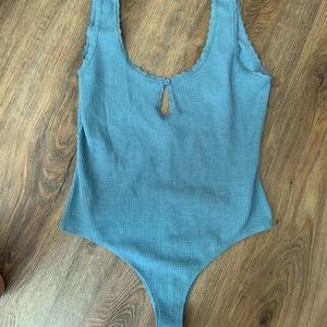 blue bodysuit